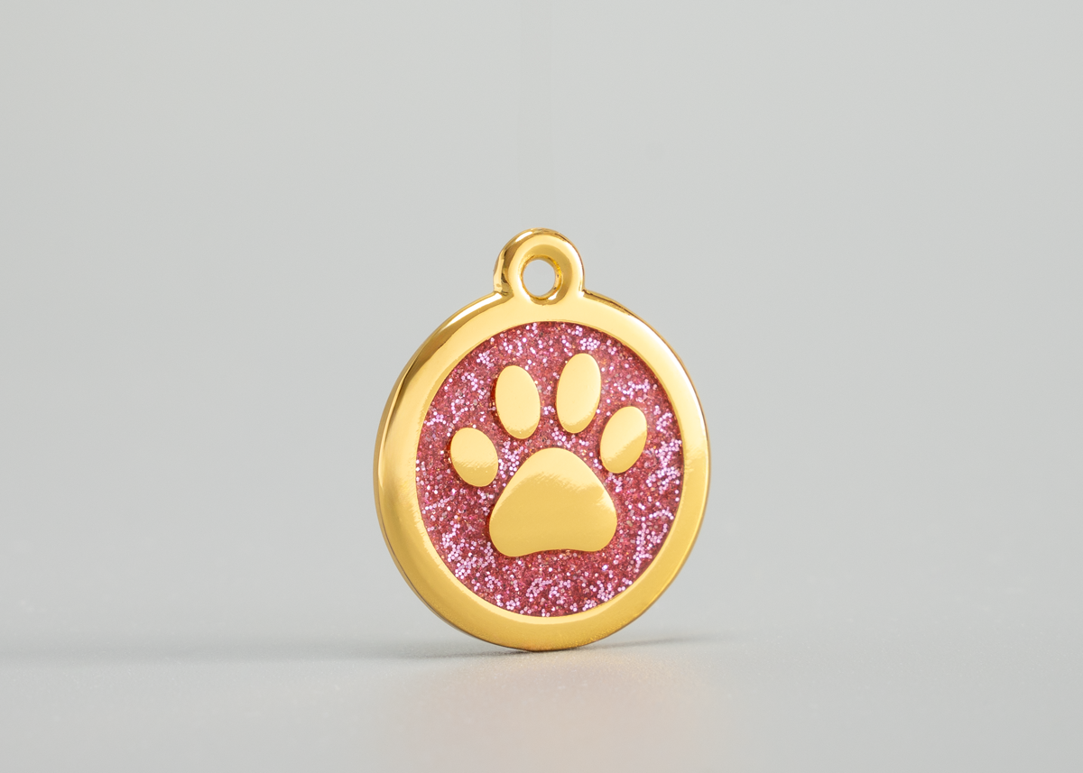 goldene Hundemarke mit Pfote