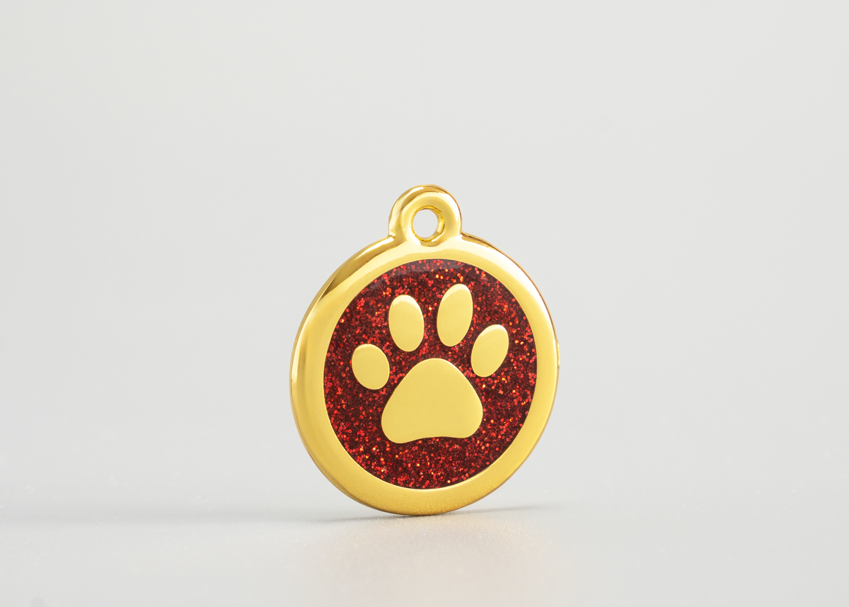 goldene Hundemarke mit Pfote