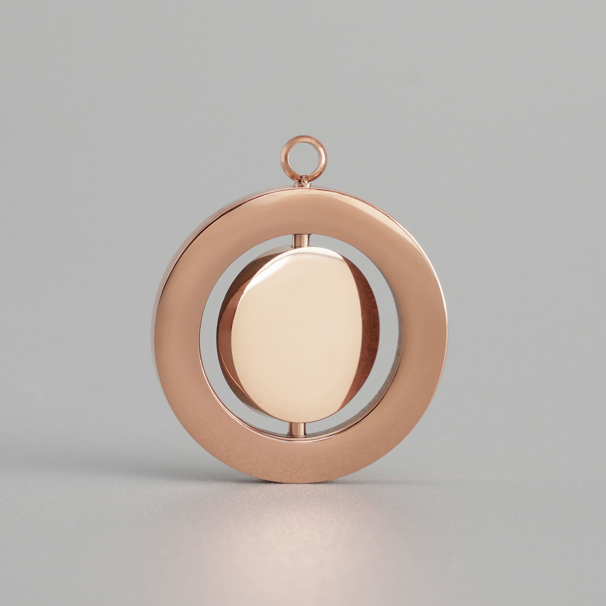 Personalisierbares Drehmedaillon aus Edelstahl in Roségold ohne Gravur
