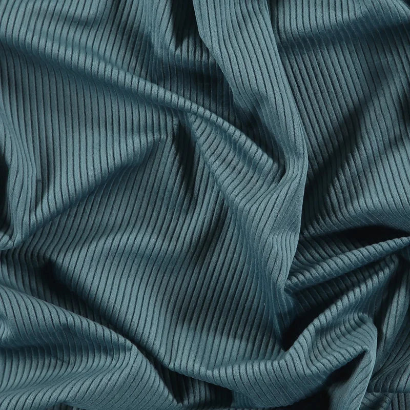 Detailaufnahme des Möbel-Micro-Cords in AquaGreen beziehungsweise Petrol für das Hundereisebett