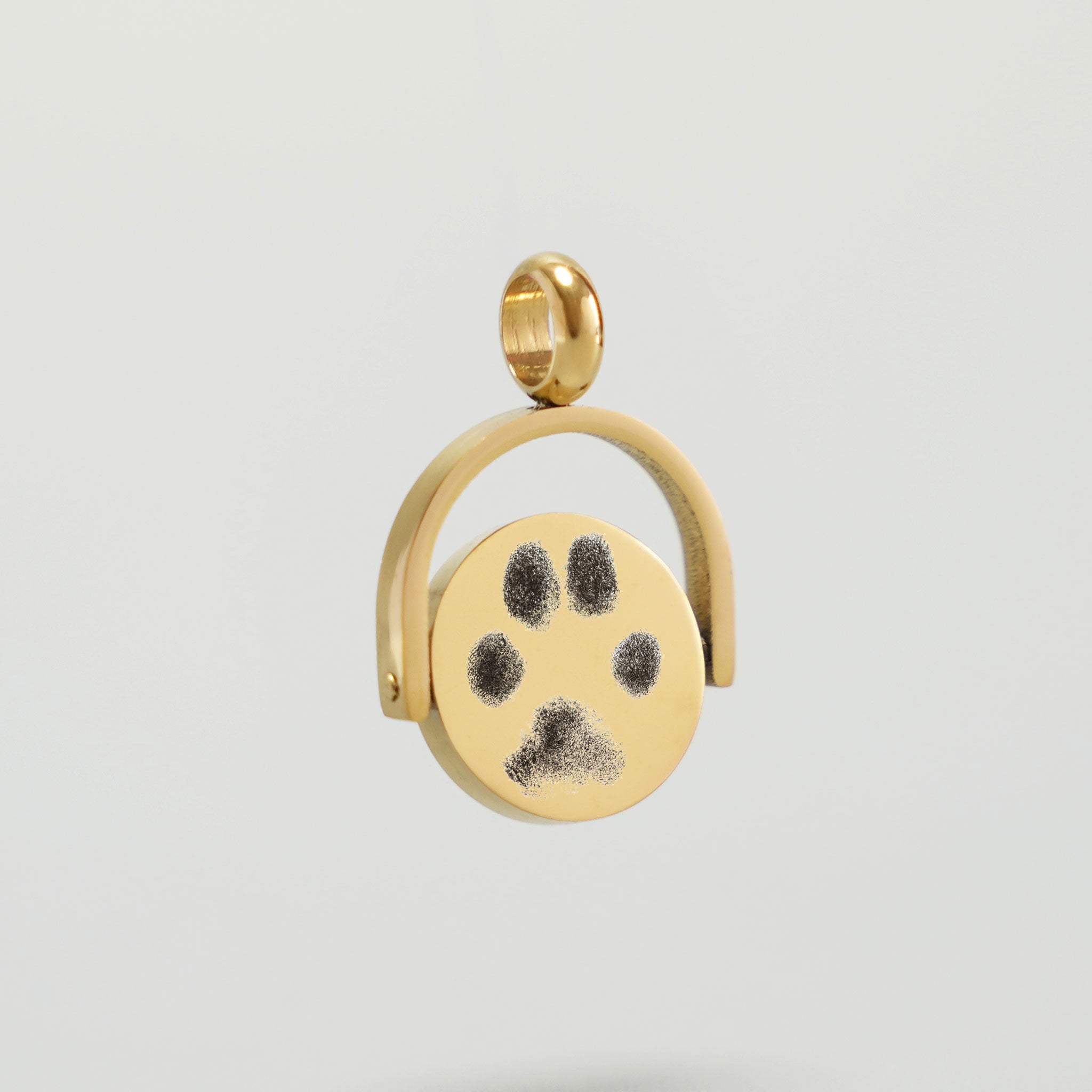Personalisiertes Drehmedaillon in Gold mit animierten Pfotenabdruck 